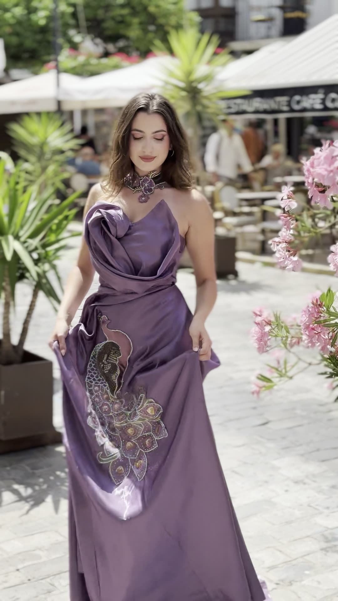 Full-length peacock-embroidered gown